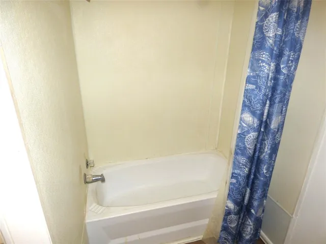 a bathroom with a bathtub