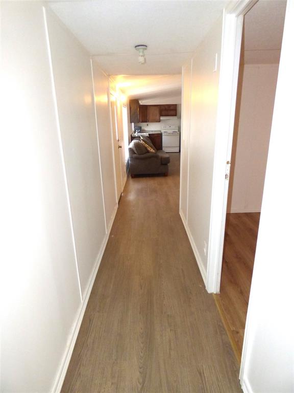 105 East 9th Street Cisco, TX 76437 - Photo 23 of 33 a view of a hallway to a livingroom with furniture