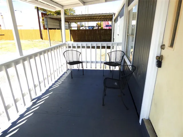 a view of balcony with wooden floor