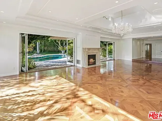 a view of a living room with a large window