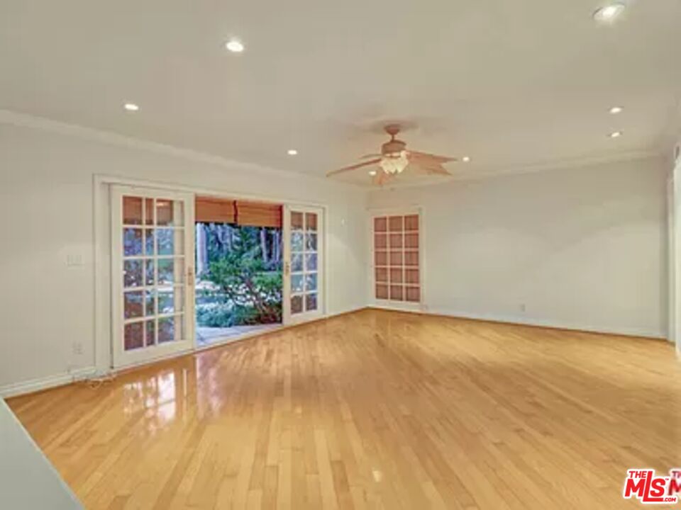 1681 Stone Canyon Road Los Angeles, CA 90077 - Photo 16 of 41 an empty room with windows