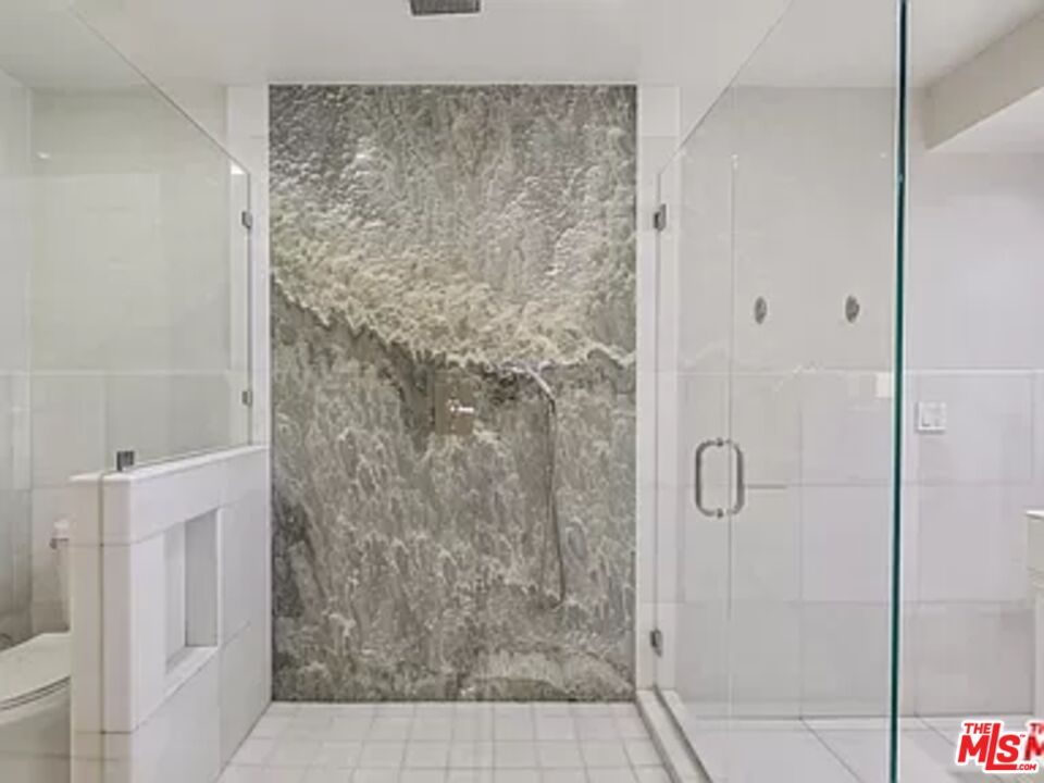 1681 Stone Canyon Road Los Angeles, CA 90077 - Photo 20 of 41 a bathroom with a shower