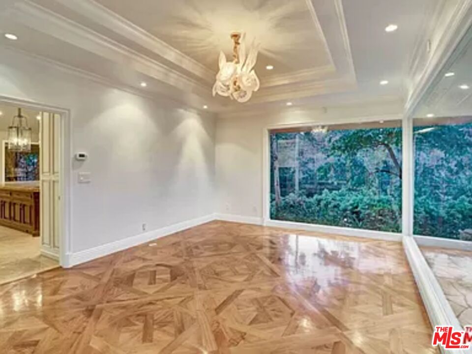 1681 Stone Canyon Road Los Angeles, CA 90077 - Photo 22 of 41 a view of an empty room with a window