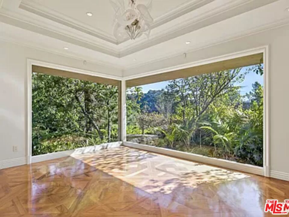 1681 Stone Canyon Road Los Angeles, CA 90077 - Photo 36 of 41 a view of a big room with a large window