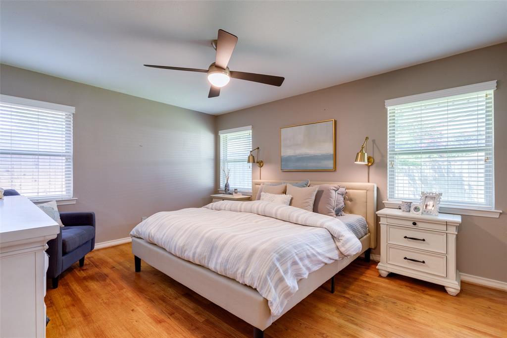 7328 Rockhurst Drive Dallas, TX 75214 - Photo 15 of 22 a bedroom with a bed and a window