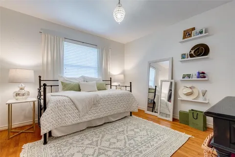 a bedroom with a bed and dresser