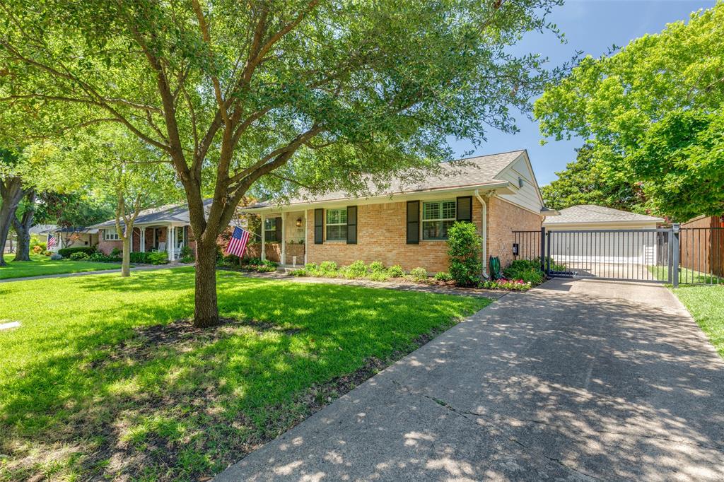7328 Rockhurst Drive Dallas, TX 75214 - Photo 2 of 22 a view of a house with a backyard and a tree