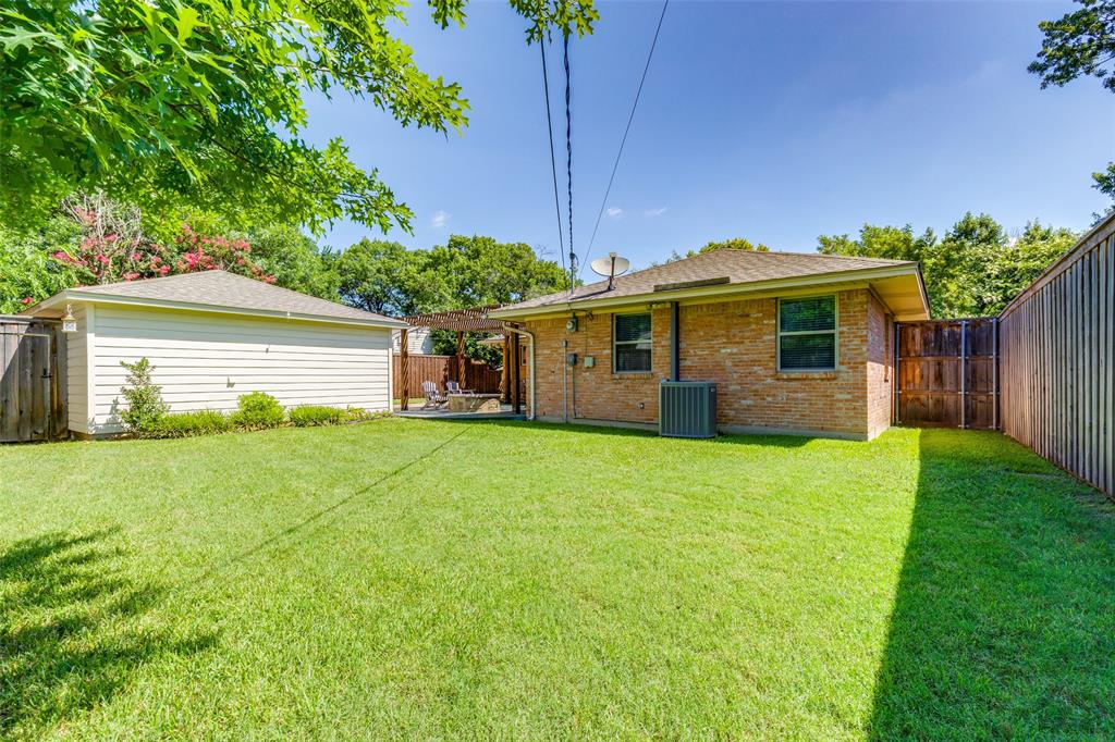 7328 Rockhurst Drive Dallas, TX 75214 - Photo 22 of 22 a front view of house with a garden