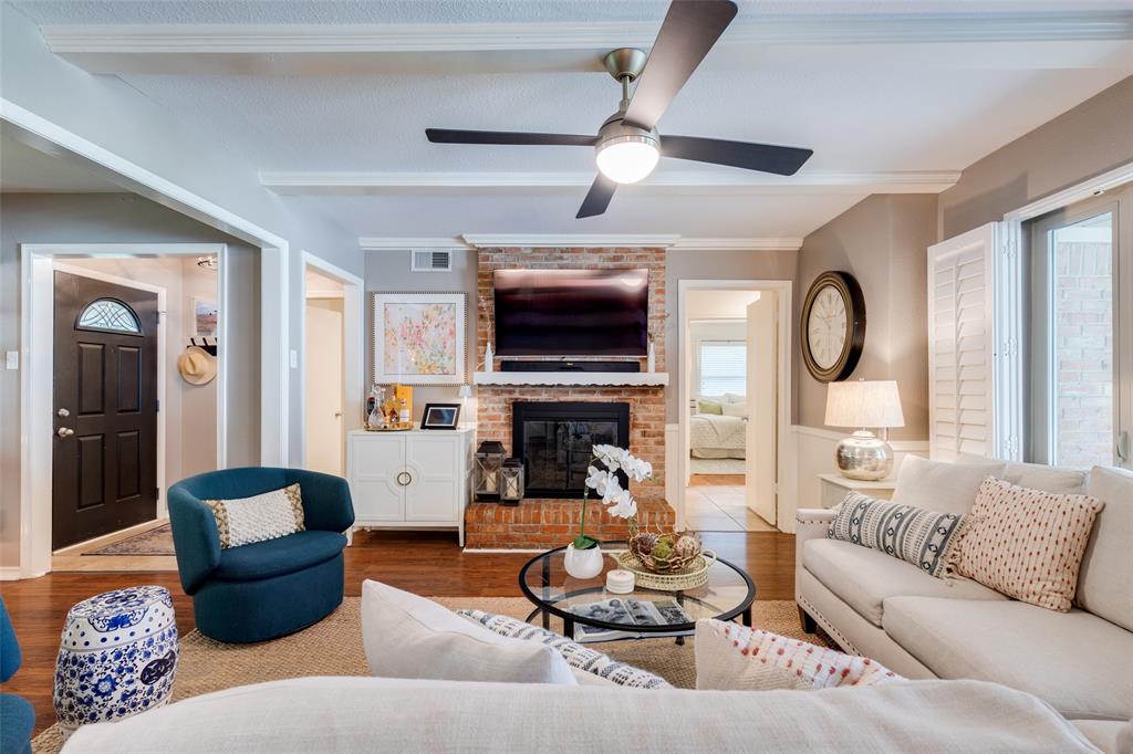 7328 Rockhurst Drive Dallas, TX 75214 - Photo 3 of 22 a living room with fireplace furniture and a flat screen tv