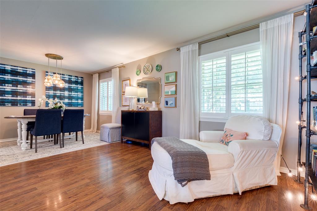 7328 Rockhurst Drive Dallas, TX 75214 - Photo 7 of 22 a bedroom with a bed and wooden floor