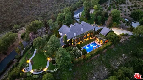 a view of a swimming pool with a lake view