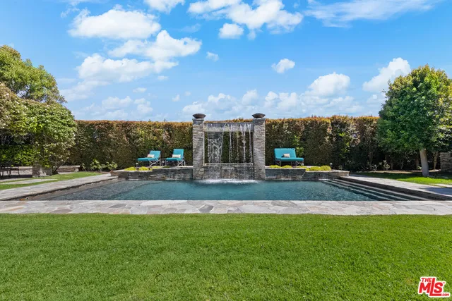a view of a patio with table and chairs and potted plants