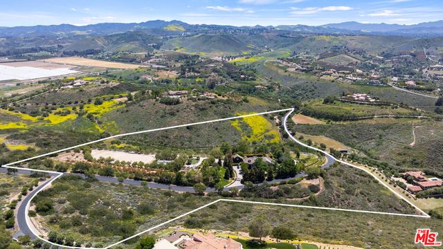 a view of swimming pool with outdoor seating and yard