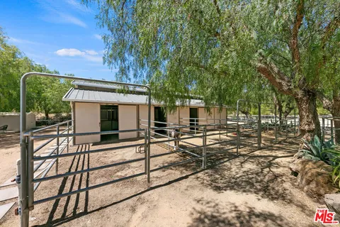 a bed room with a bed and a large window