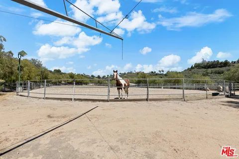 a spacious bedroom with a bed and a window