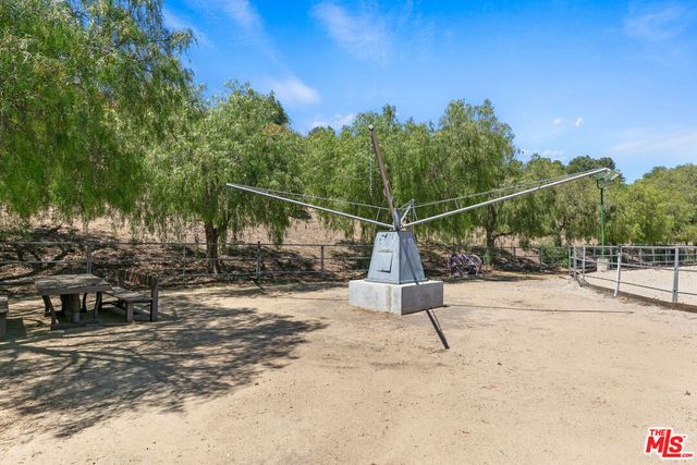 a view of a house with a mountain in the background