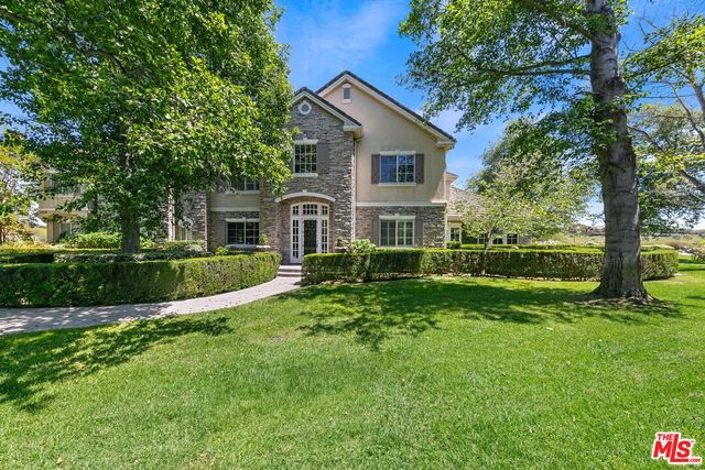 a garden view with a fountain