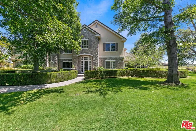a garden view with a fountain