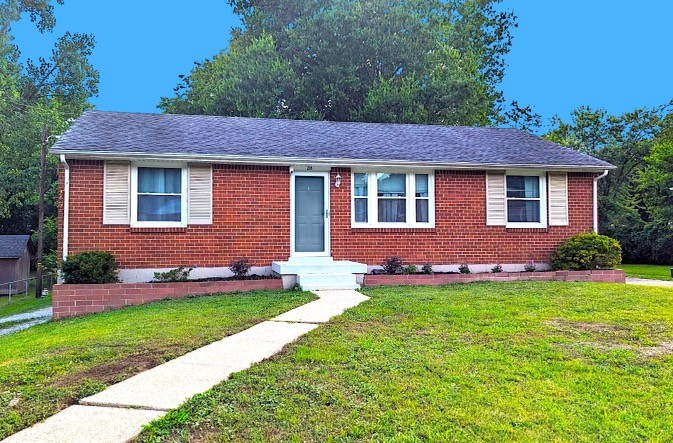 218 Jacksonian Drive Hermitage, TN 37076 - Photo 1 of 15 a front view of a house with a yard