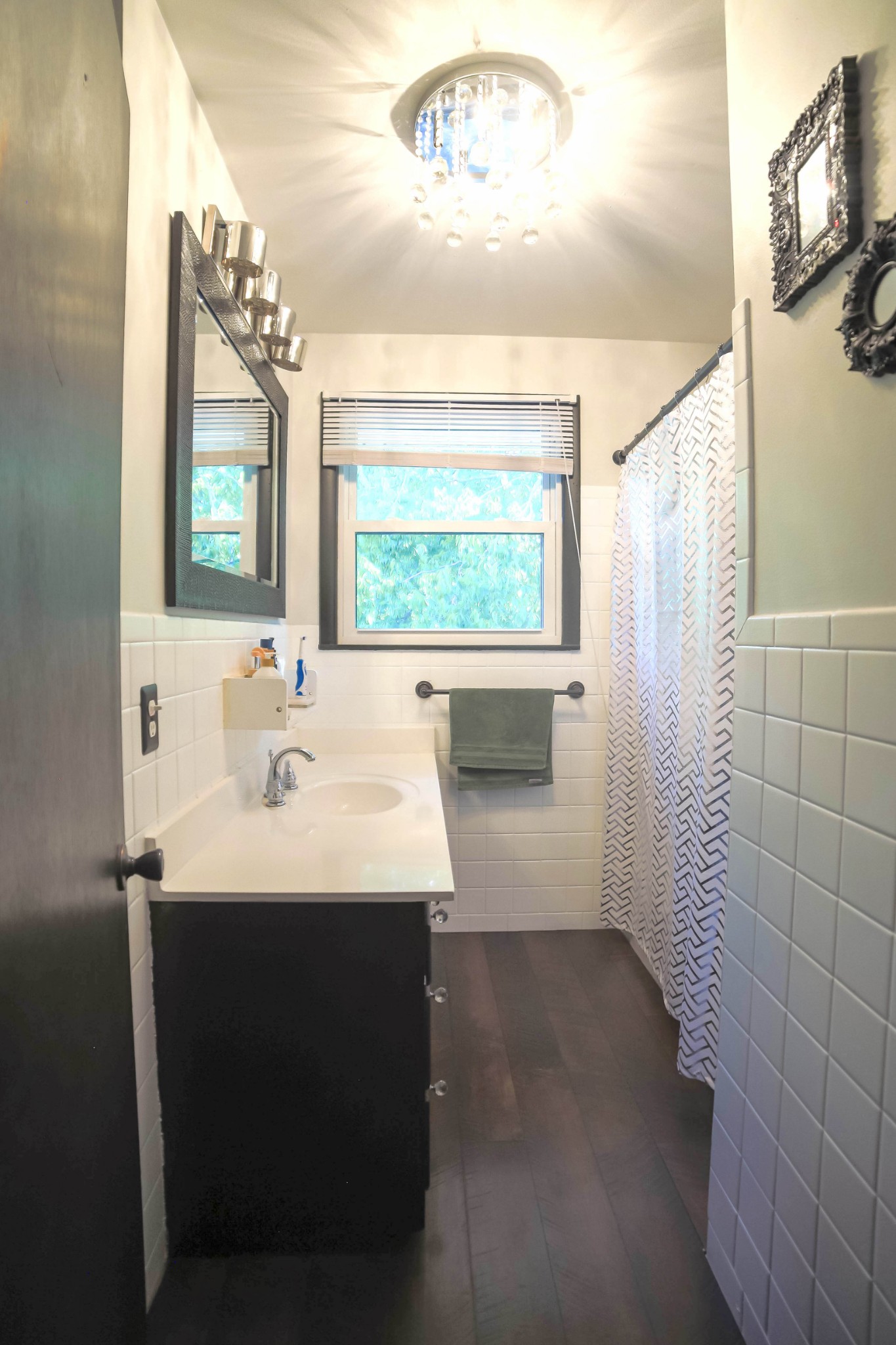 218 Jacksonian Drive Hermitage, TN 37076 - Photo 7 of 15 a bathroom with a sink a large mirror and a bathtub