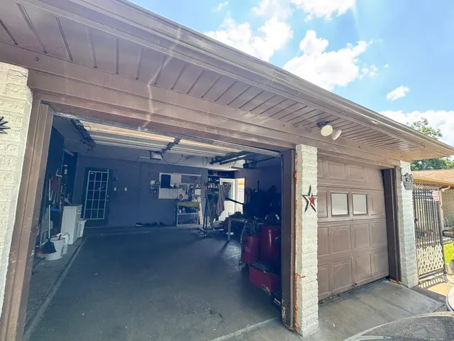 a view of house with backyard space and garden