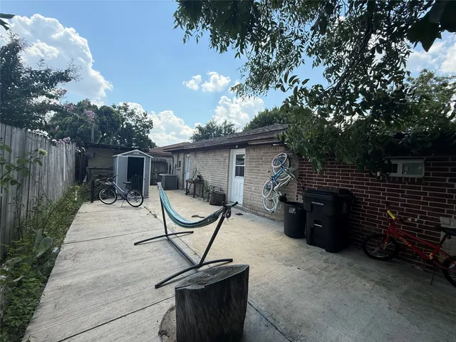 a view of a patio with a table and chairs