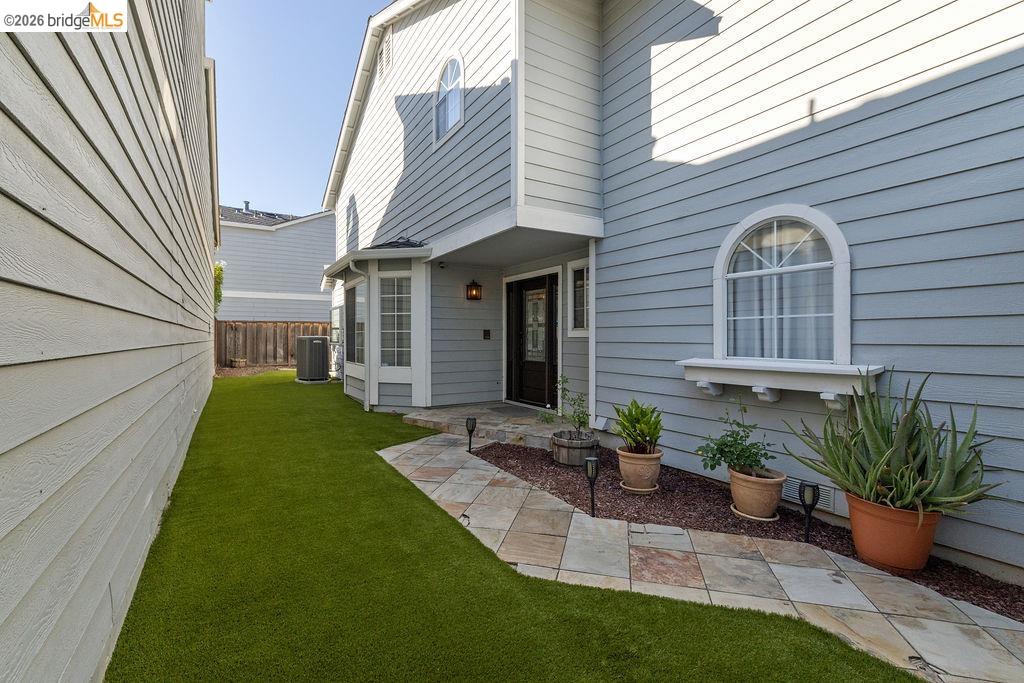 724 Winterside Circle San Ramon, CA 94583 - Photo 2 of 43 Light blue horizontal siding exterior featuring a decorative arched window with a window box