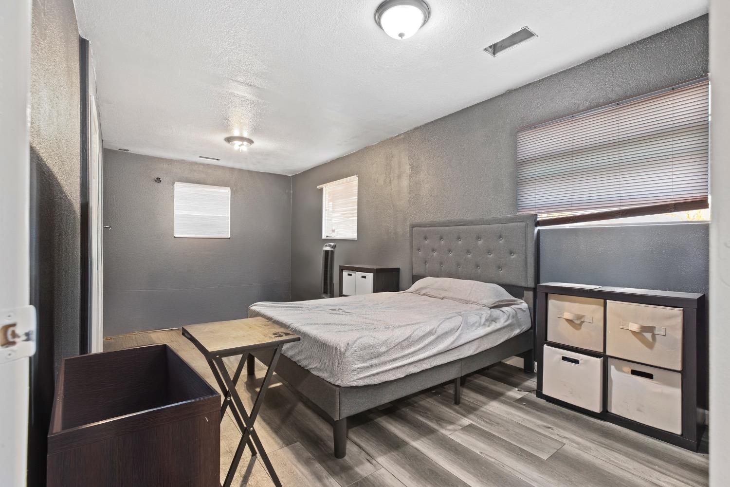 1813 Poppy Lane Ceres, CA 95307 - Photo 11 of 27 a bedroom with a bed and a dresser