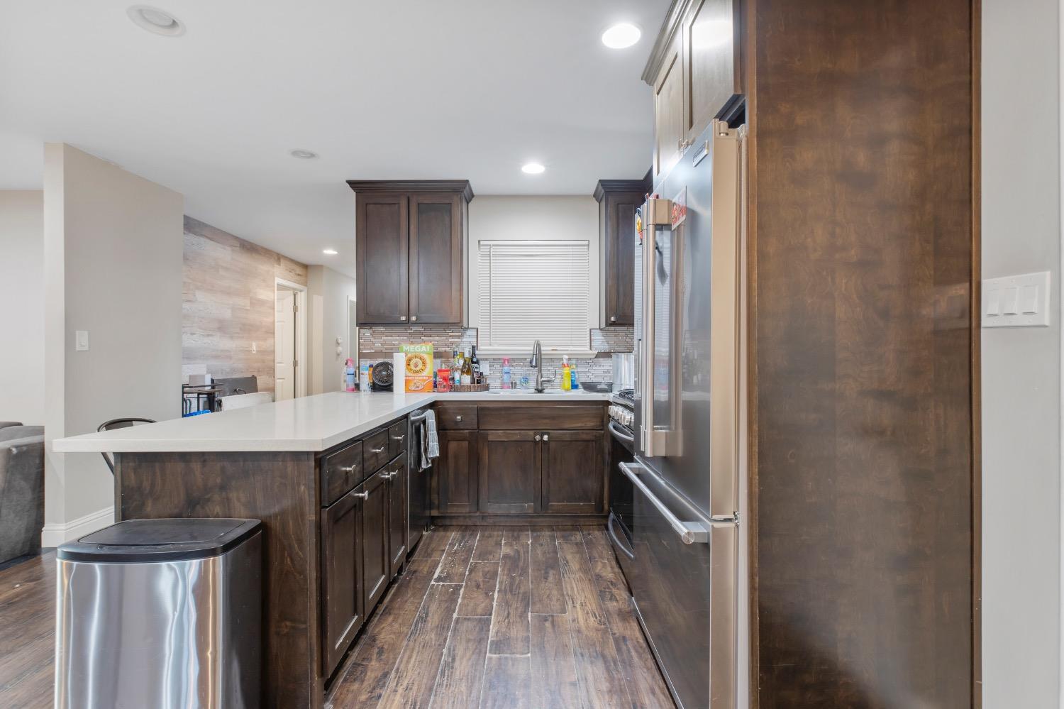 1813 Poppy Lane Ceres, CA 95307 - Photo 15 of 27 a kitchen with a sink refrigerator and cabinets