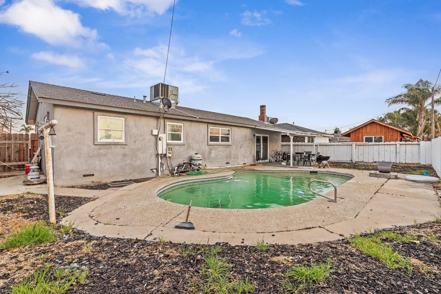 1813 Poppy Lane Ceres, CA 95307 - Photo 25 of 27 a front view of a house with a yard