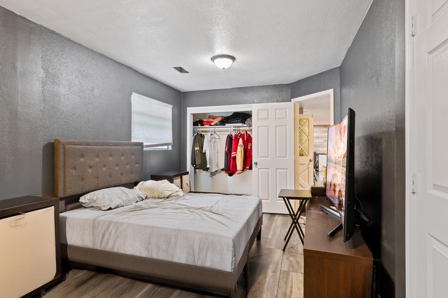 1813 Poppy Lane Ceres, CA 95307 - Photo 9 of 27 a bedroom with a bed and a closet