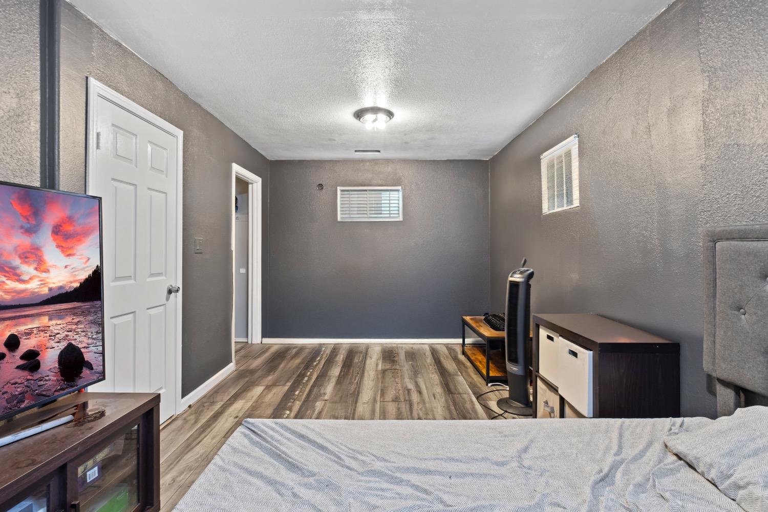 1813 Poppy Lane Ceres, CA 95307 - Photo 10 of 27 a bedroom with a bed and a flat screen tv