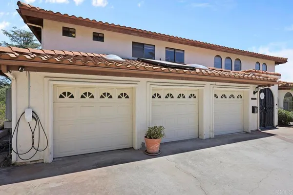 a view of a house with large windows