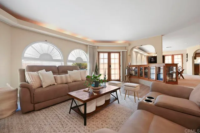 a kitchen with a sink a stove top oven and cabinetry