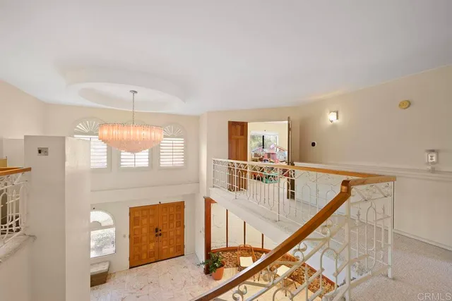 a view of a balcony with furniture