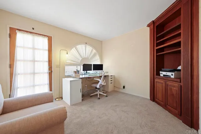 a spacious bedroom with a bed and furniture