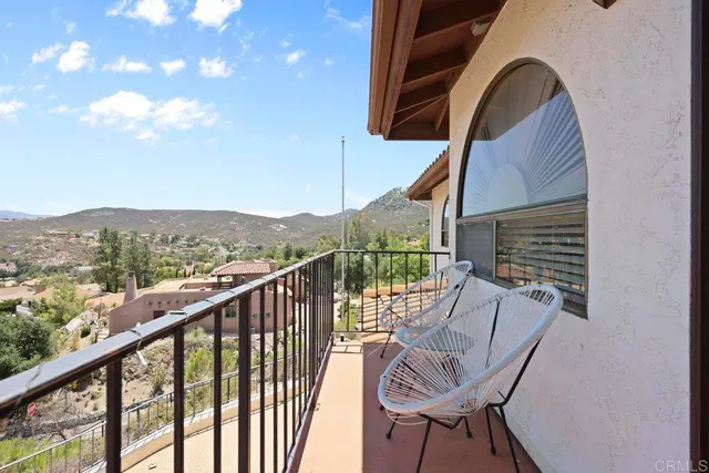 a spacious bathroom with double sink and a large mirror
