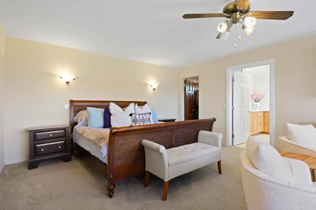 a white bath tub sitting next to a white toilet