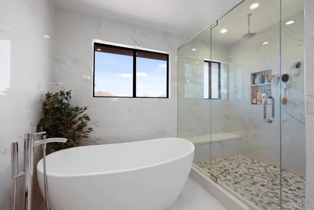 a view of a bathroom with a sink and a mirror