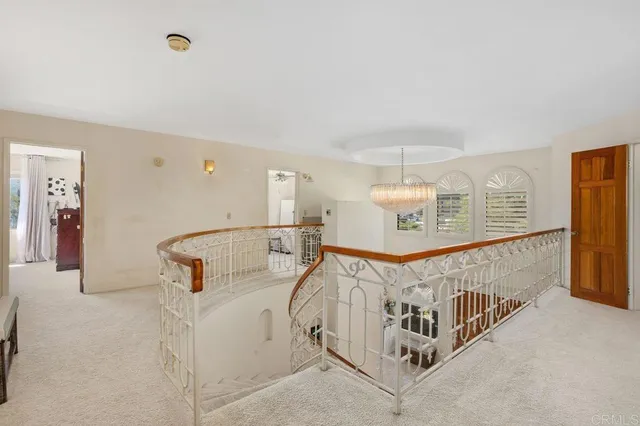 an aerial view of a house with yard and trees
