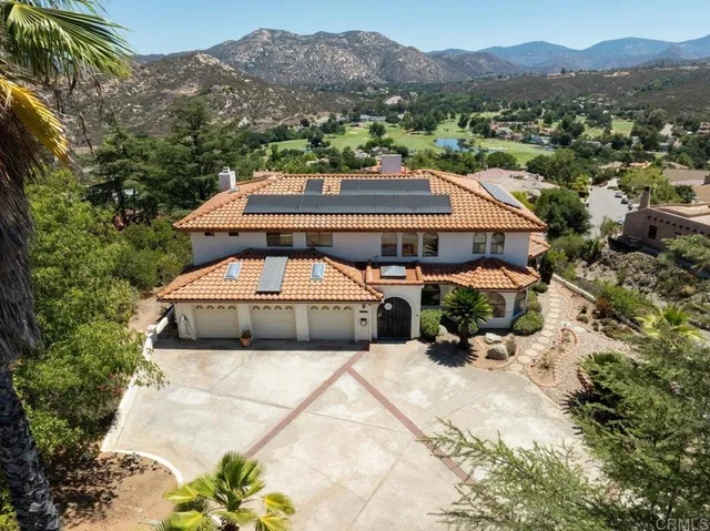 an aerial view of a house with a garden