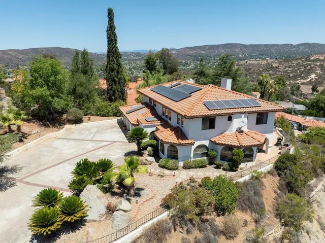 an aerial view of a house with a garden