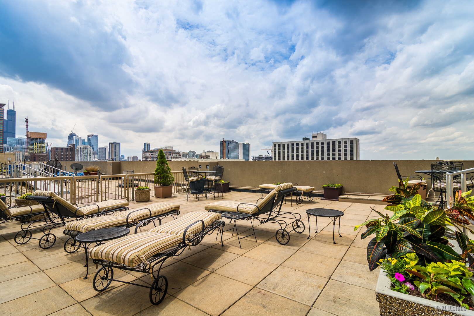 111 West Maple Street, Unit 2406 Chicago, IL 60610 - Photo 12 of 18 a terrace with outdoor seating city view and barbeque oven
