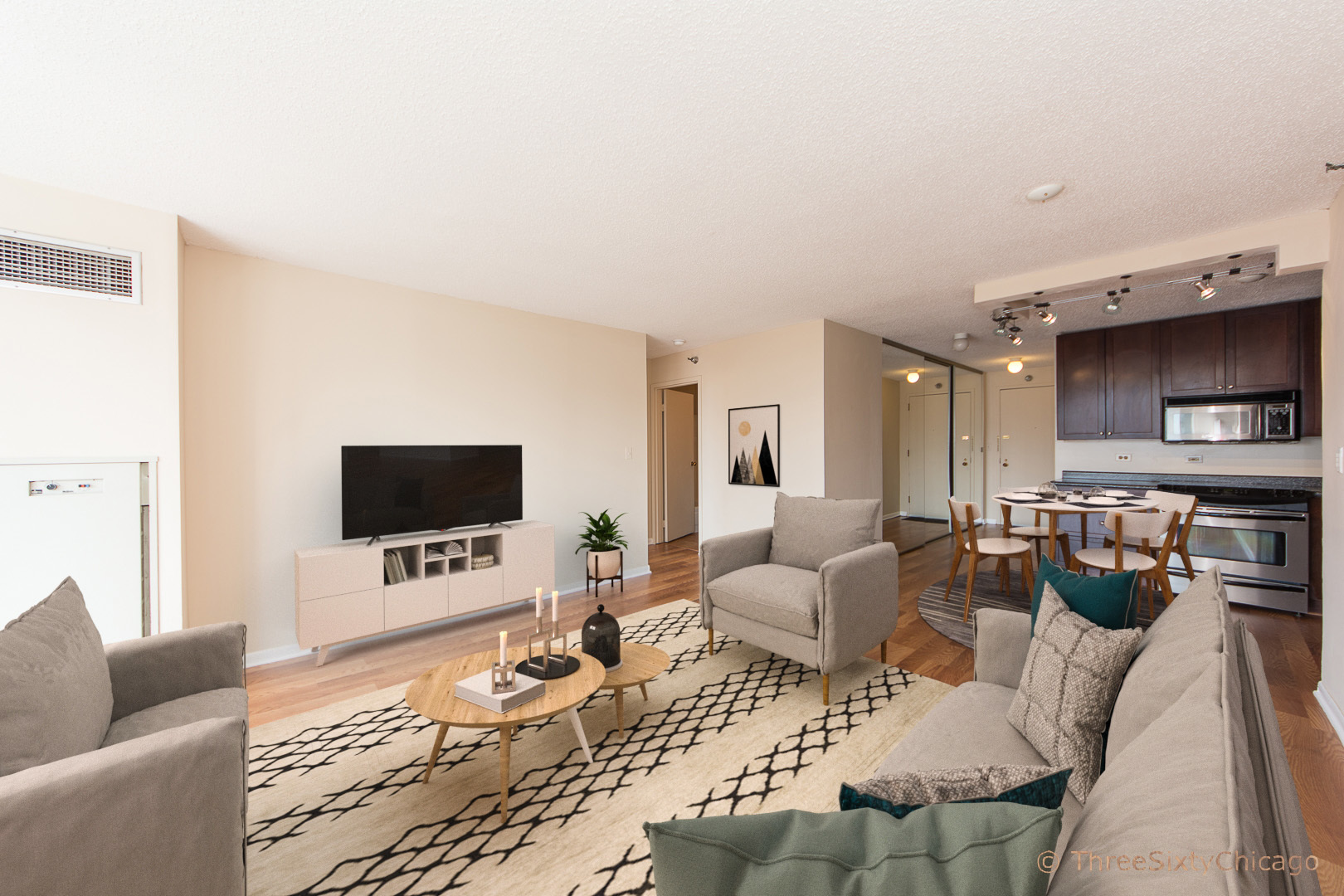 111 West Maple Street, Unit 2406 Chicago, IL 60610 - Photo 3 of 18 a living room with furniture and a flat screen tv