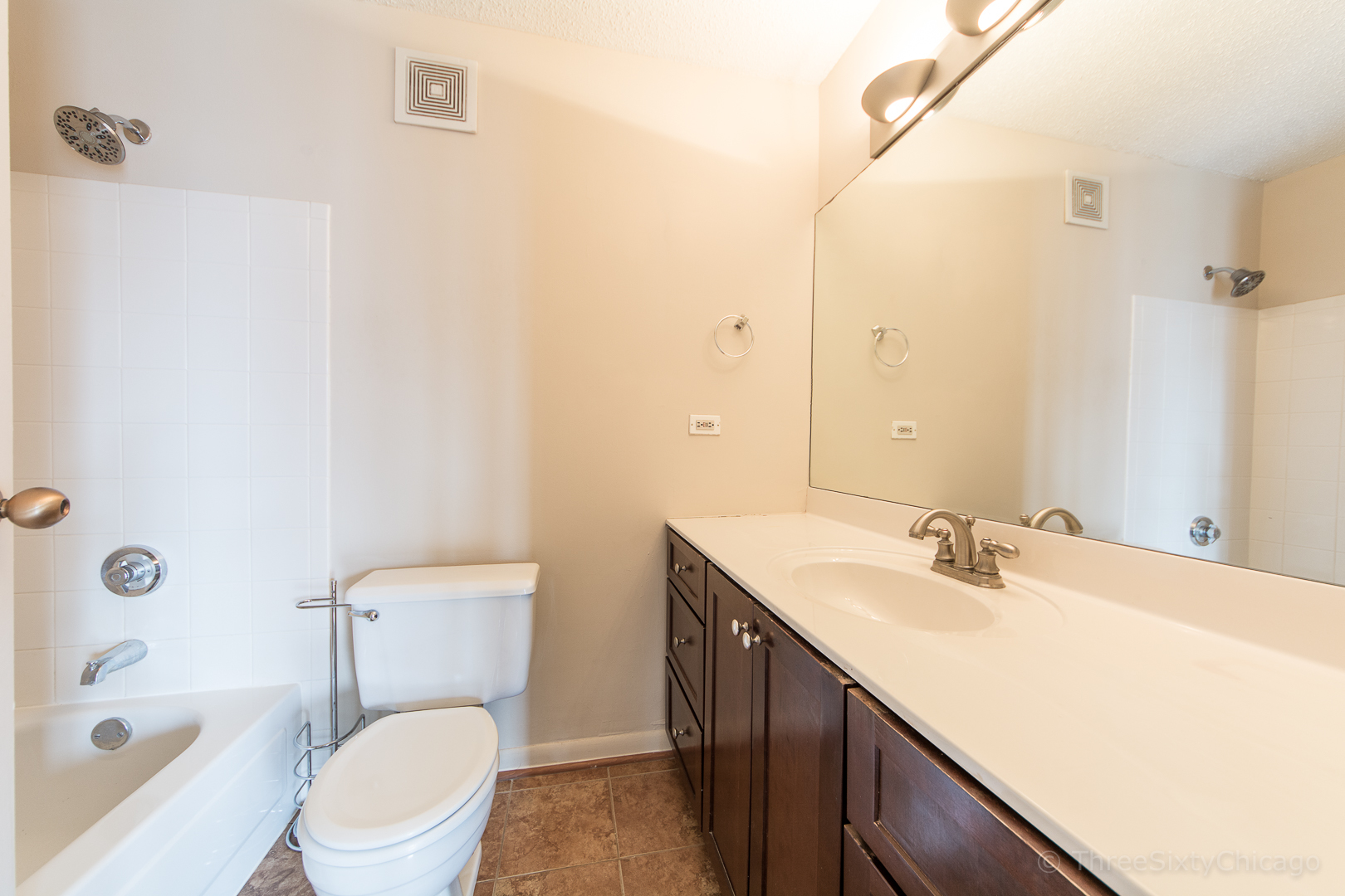 111 West Maple Street, Unit 2406 Chicago, IL 60610 - Photo 8 of 18 a bathroom with a sink a toilet and shower