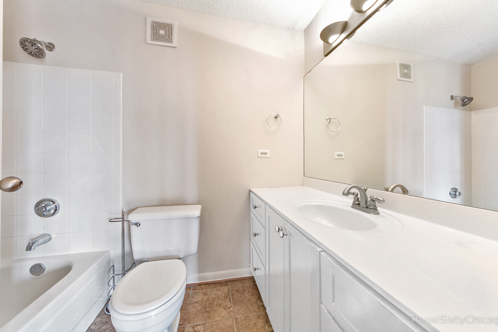 111 West Maple Street, Unit 2406 Chicago, IL 60610 - Photo 9 of 18 a bathroom with a sink a toilet and shower