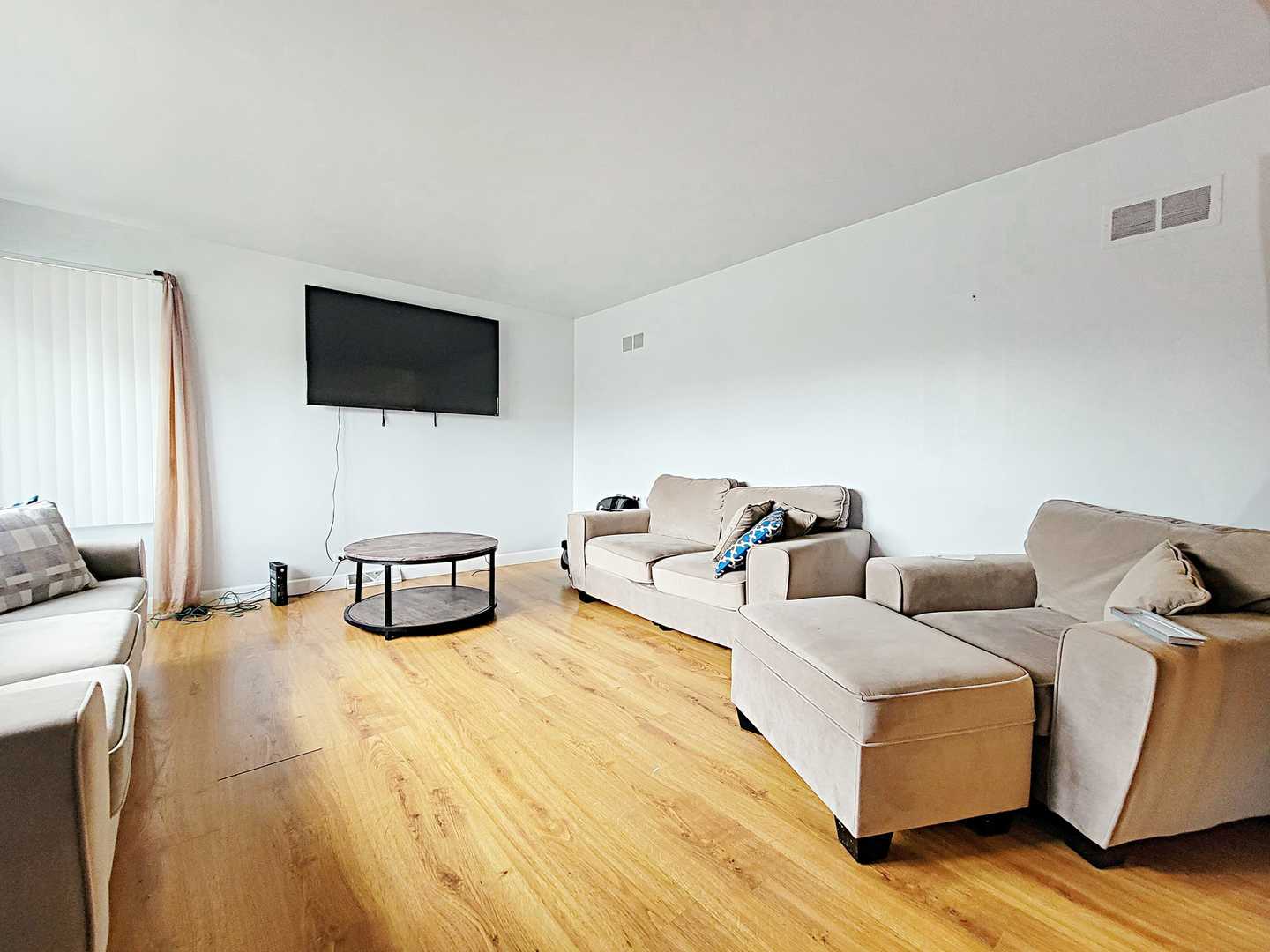 Undisclosed Address Dolton, IL 60419 - Photo 2 of 9 a living room with furniture and a flat screen tv