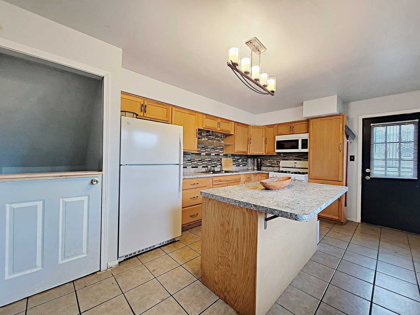 Undisclosed Address Dolton, IL 60419 - Photo 3 of 9 a kitchen with stainless steel appliances granite countertop a refrigerator a sink dishwasher and white cabinets with wooden floor