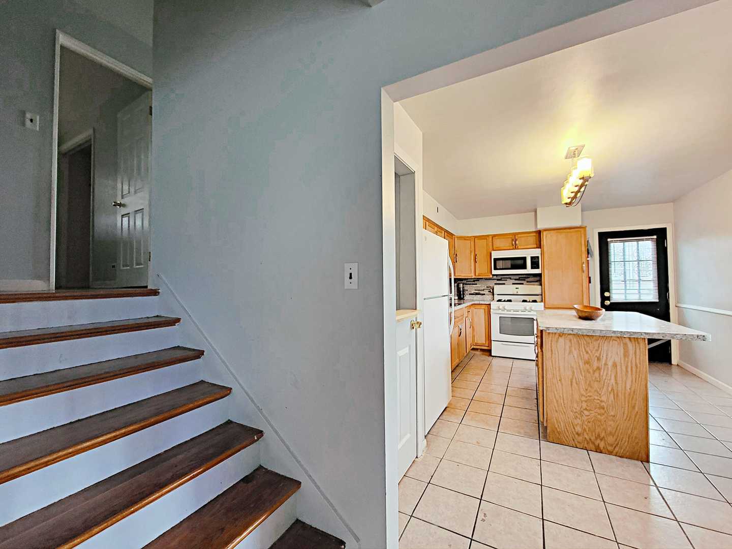 Undisclosed Address Dolton, IL 60419 - Photo 4 of 9 a view of kitchen with furniture and a fireplace