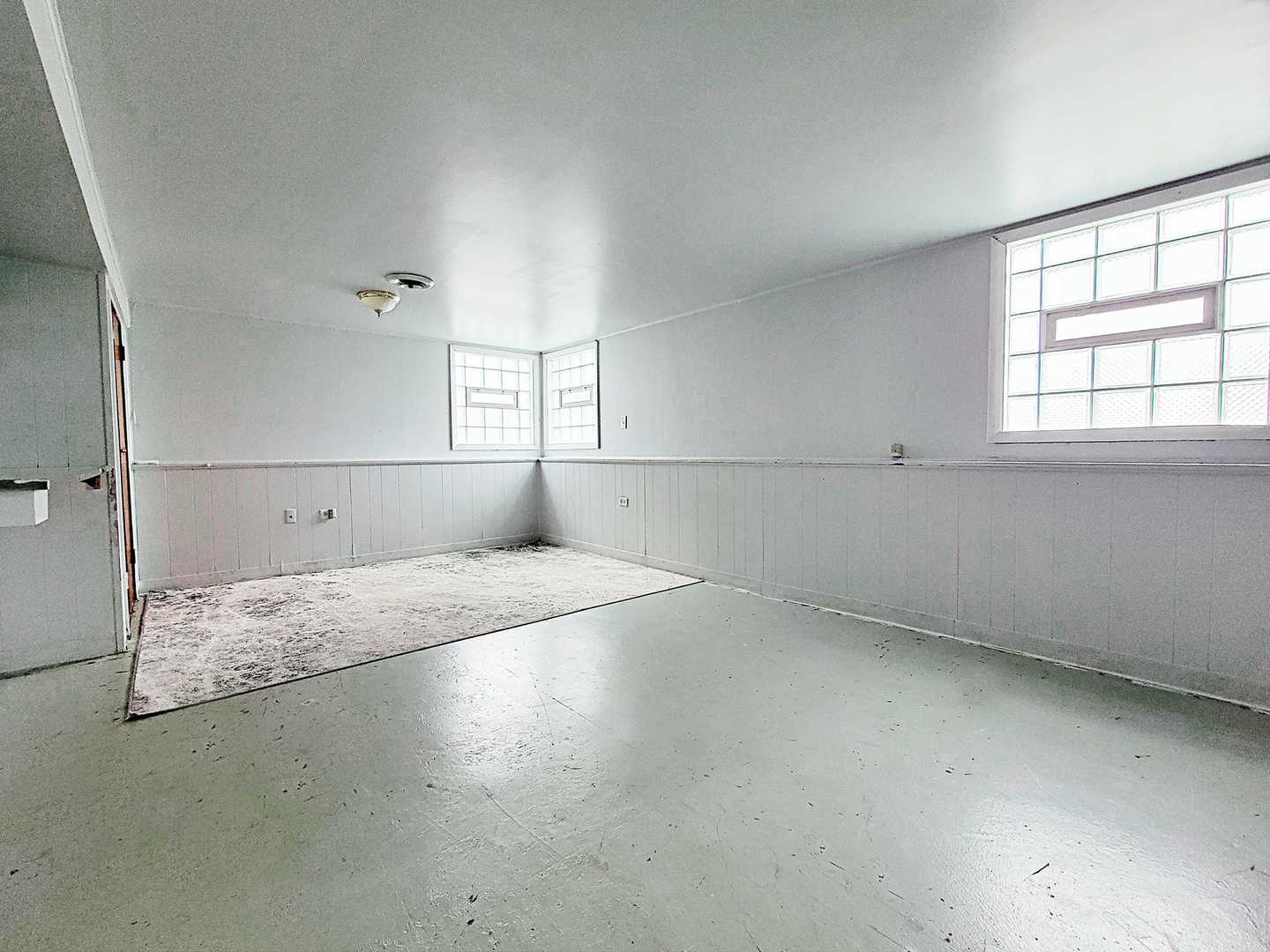 Undisclosed Address Dolton, IL 60419 - Photo 8 of 9 an empty room with a empty space and windows